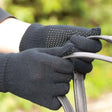 Harlequin adult size black knitted work gloves with white pimple grip palm dots for secure handling