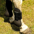 Black harlequin neoprene tendon boots with velcro strap for hoof protection and support