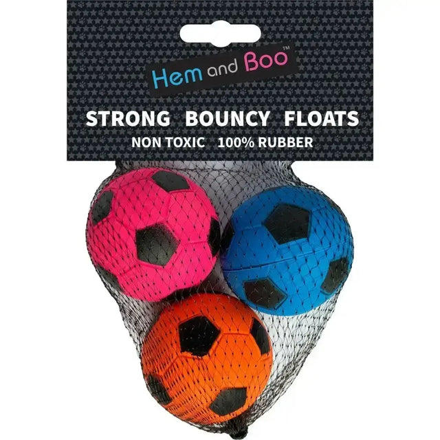 Three brightly colored pink blue and orange boo foam sponge footballs dog toys with black panels packaged together
