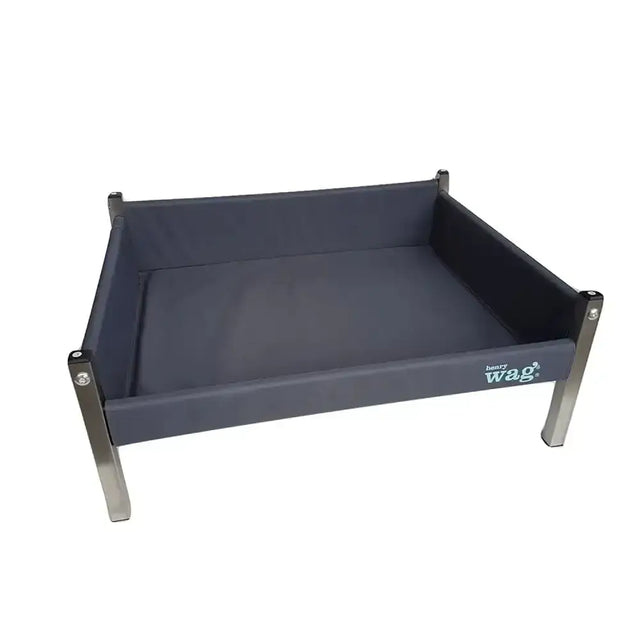Dark gray canvas henry wag elevated dog bed with stainless steel legs and firm wooden base logo on the side