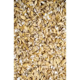 A pile of golden brown dried malted grains with white powdery residue in henrys rolled barley micronised product
