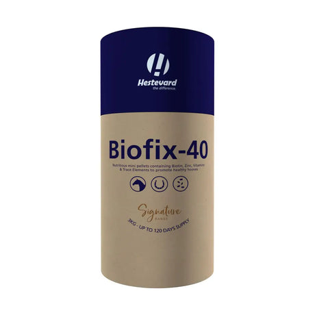 A cylindrical hestevard biofix 40 container with navy blue top and beige body containing horse hoof supplements in mini pellet form