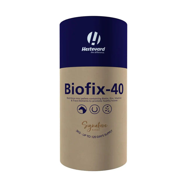A cylindrical hestevard biofix 40 container with navy blue top and beige body containing horse hoof supplements in mini pellet form