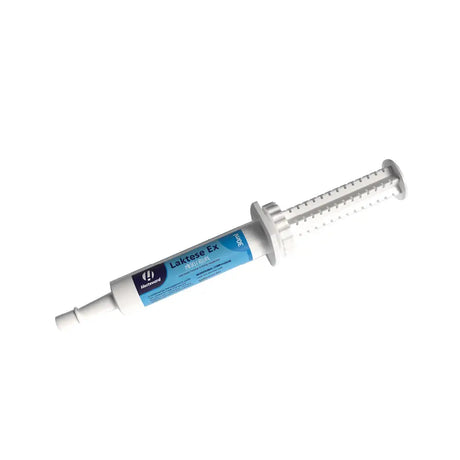 White plastic syringe with blue and white laktase ex label by hartmann for hestevard laktese to promote muscle function and energy metabolism