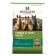 Green and white bag of heygates horse pony nuts feed 20 kg with images of three horses for equestrian use