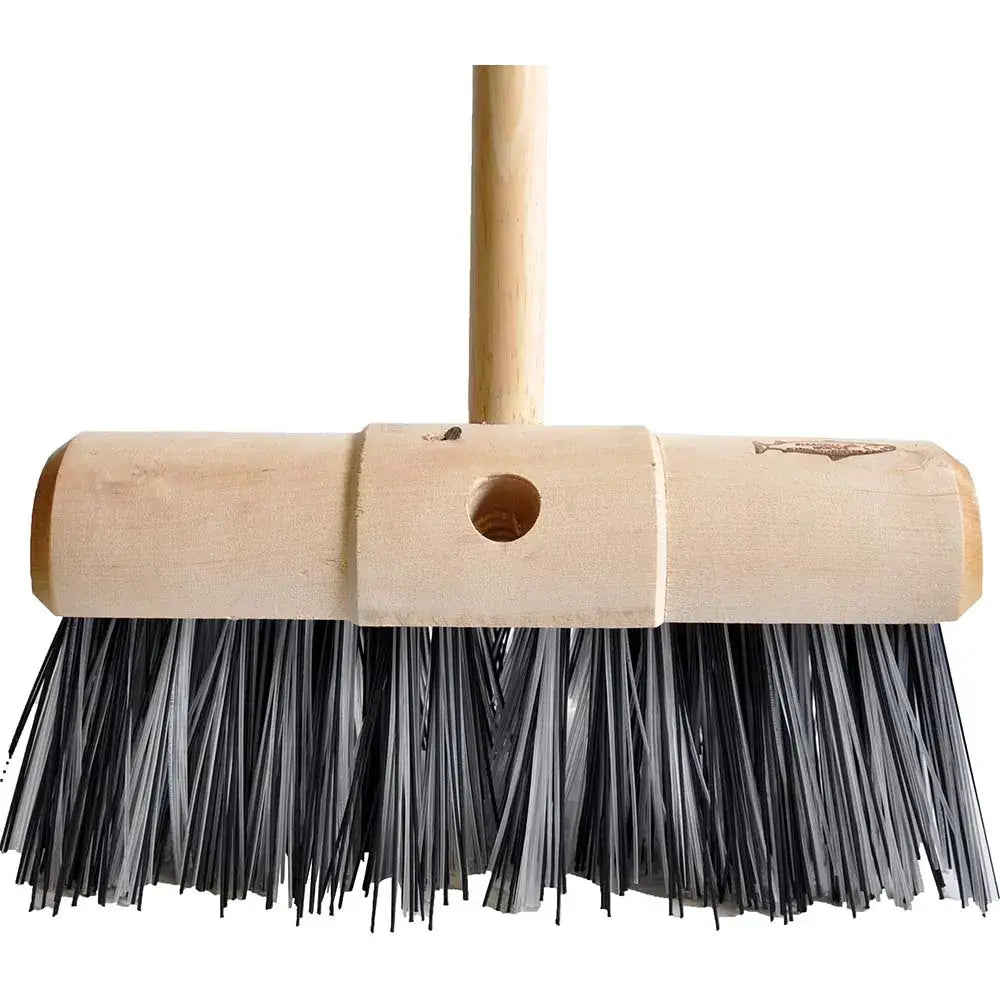 A hillbrush finest 330mm yard broom with a light tan wooden handle and dense black stiff bristles for tough cleaning