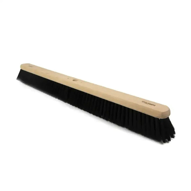 A hillbrush industrial soft black coco platform broom head with a long wooden handle and dense black bristles