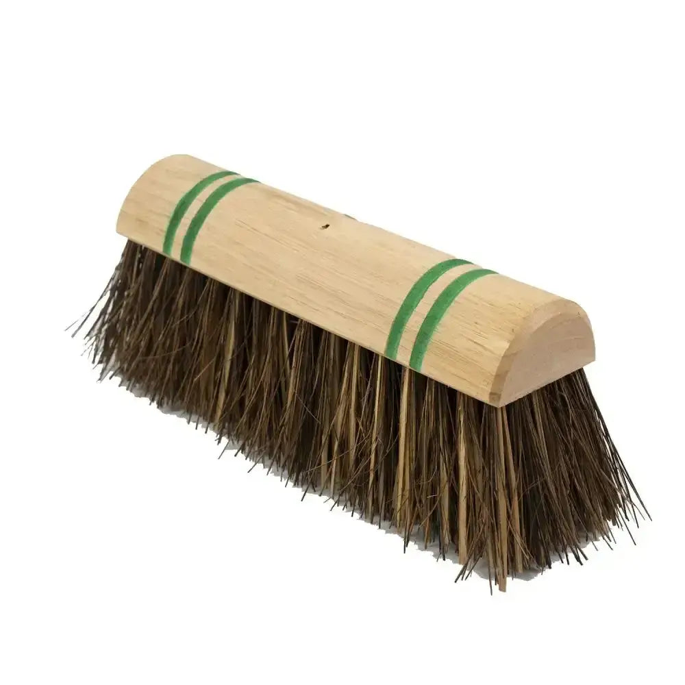 Hillbrush industrial stiff mixed yard broom with sturdy light brown wooden handle, green stripes, and dense dark bristles