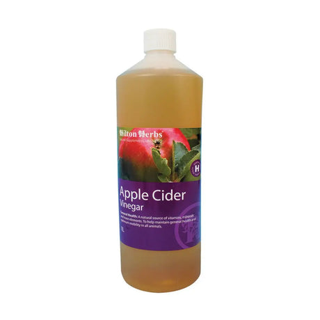 A 1 liter bottle of hilton herbs cider vinegar with a white cap and purple label showing an apple image