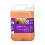 A 5-liter jug of hilton herbs cider vinegar with a purple label white handle and amber liquid inside