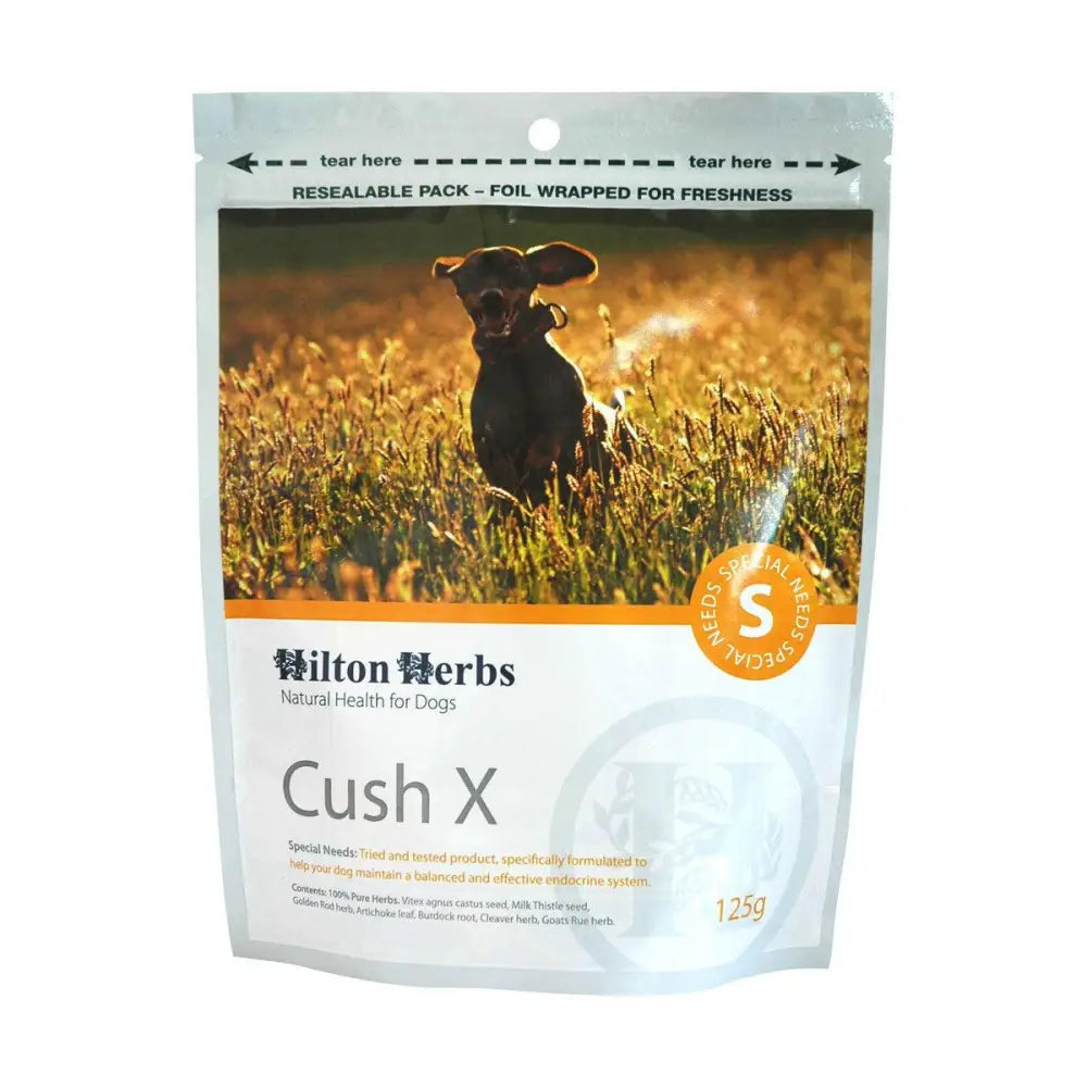 A 125g resealable foil pack of hilton herbs cushx dog supplements featuring a black dog in golden grass on the front