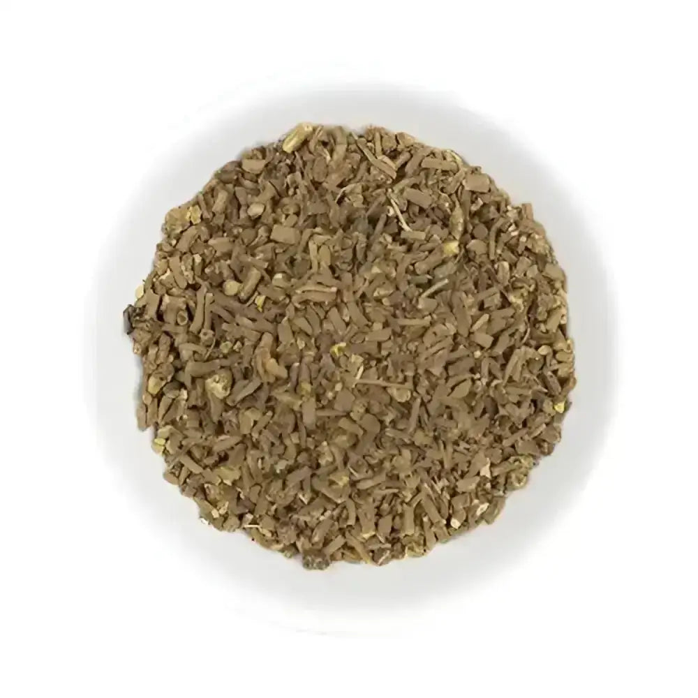 A white bowl filled with dried chopped brown herbs for hilton herbs valerian root horse supplements