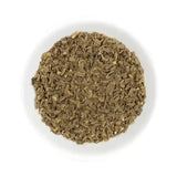 A white bowl filled with dried chopped brown herbs for hilton herbs valerian root horse supplements