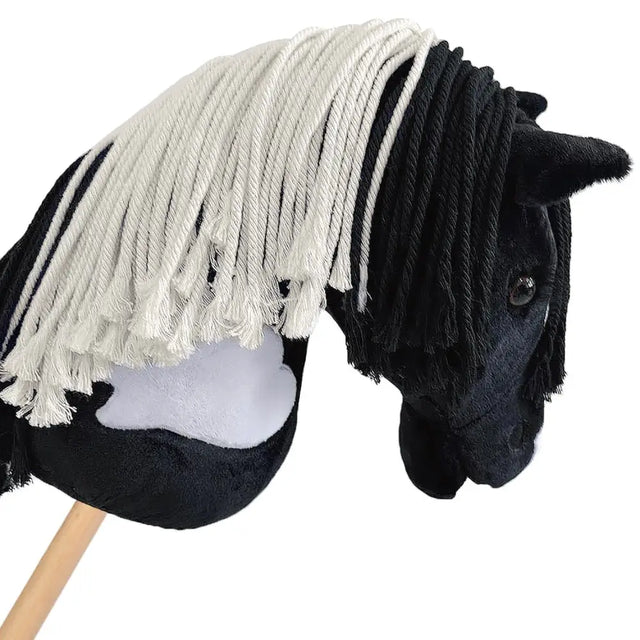 Black plush hobby horse magpie with white fringe mane and light gray side patch hand stuffed hobby toy
