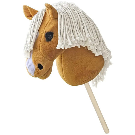 A tan hand stuffed hobby horse pancake with white fringe mane and black eyes mounted on a wooden stick