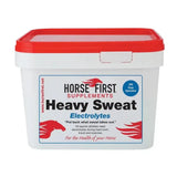 White plastic container with red lid labeled horse first heavy sweat supplements to replace salts lost and ensure horses thrive