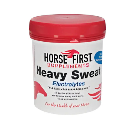 White cylindrical container with red lid of horse first heavy sweat electrolytes supplement to replace salts lost and ensure horses