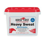 White plastic container with red lid horse first heavy sweat formulated supplement to replace salts lost and ensure horses