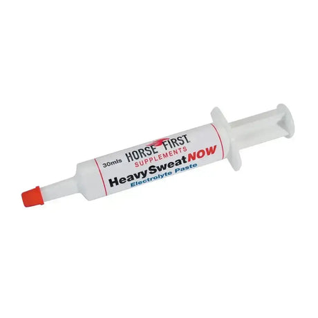 White plastic syringe tube with red cap labeled horse first heavy sweat now electrolyte paste for horse electrolytes