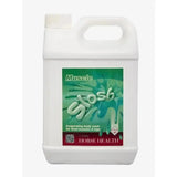 White plastic jug with green and maroon label of muscle slosh invigorating body wash for horse health muscle care