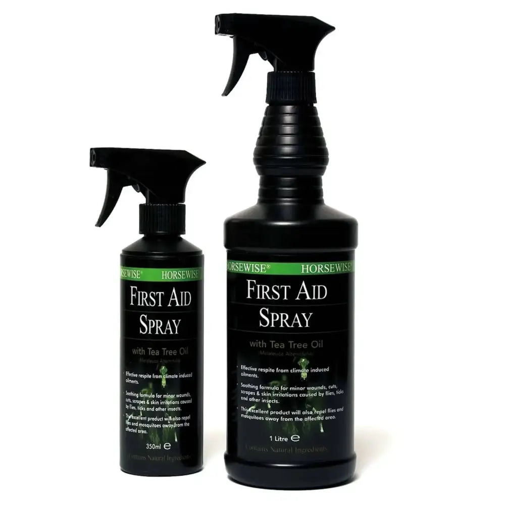 Black plastic spray bottles of horsewise first aid spray with green and white label featuring tea tree oil for horse care