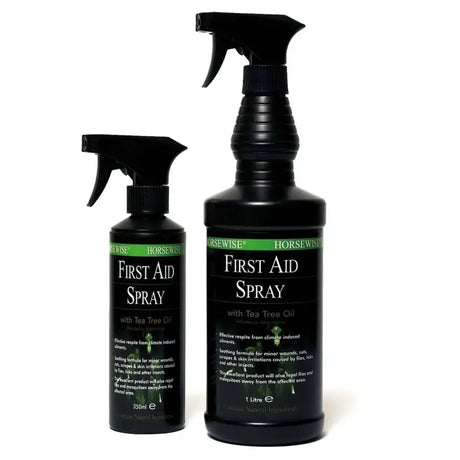 Black plastic spray bottles of horsewise first aid spray with green and white label featuring tea tree oil for horse care