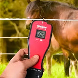 Red hotline digital electric fence tester with a digital display showing 106 volts for easy voltage reading