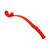 Bright red plastic toy spoon with textured grip handle for paws ball launcher and christmas tennis ball play