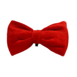 A vibrant red velvet bow tie with plush texture and stitched edges from house of paws paws christmas toy collection