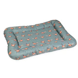 A plush quilted paws water resistant crate mat in muted sage green with illustrated pheasants pattern