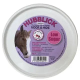 A white plastic tub of hubblick hoof low sugar hide horse lick with purple label supports skin health for horses