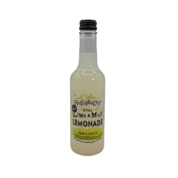 A clear glass bottle of hullabaloos lime and mint lemonade 330ml with green label accents and black screw-top cap, ideal refreshing drink with sandford orchards cider vibes
