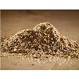 A mound of brown granular cooked linseed meal with specks used as fish bait from hutton mill