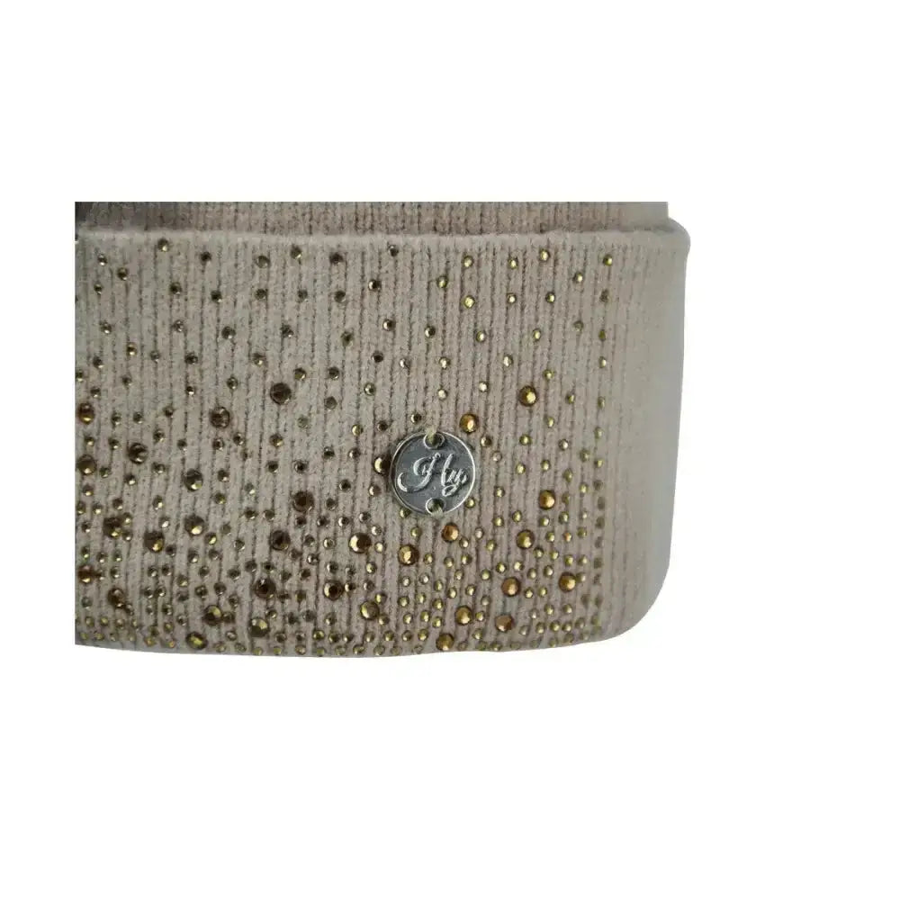 Beige textured belt with gold and silver rhinestones and a metallic logo on the equestrian alaska diamante bobble hat