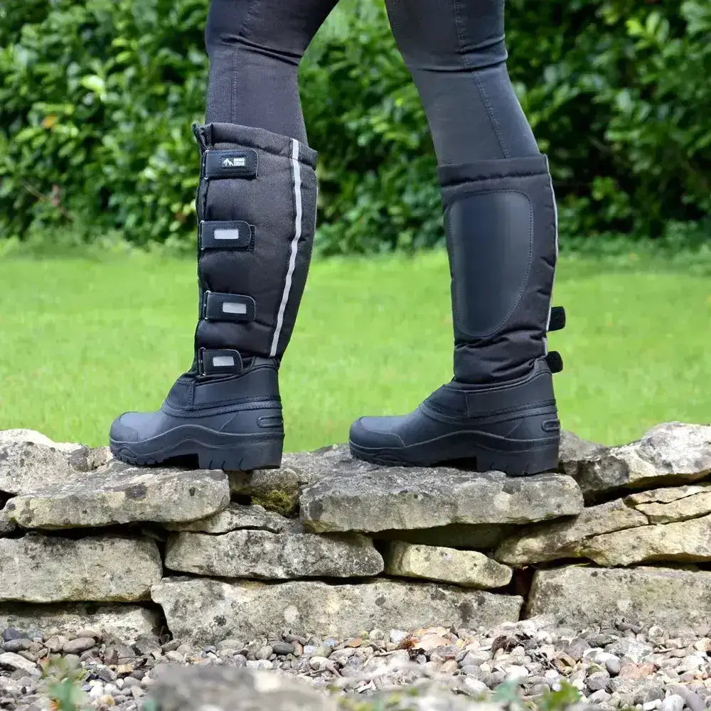 Black insulated hy equestrian atlantic winter boots with reflective stripes adjustable straps and high sided sole