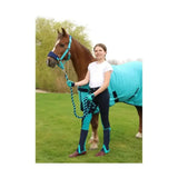 Teal and navy horse blanket with black straps shown with equestrian belton children’s riding gloves for kids use