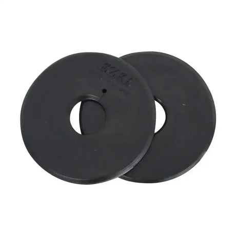Black rubber equestrian bit guards with central hole and embossed markings designed to protect horse’s mouth