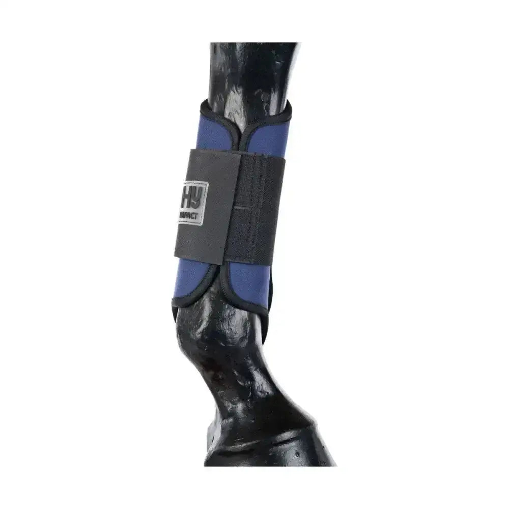 Blue and black hy equestrian brushing boots with gray strap and hy logo designed for horse ankle protection