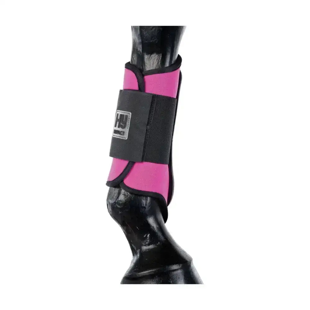Pink and black hy equestrian brushing boots with branded label for horse ankle protection and equestrian brushing use