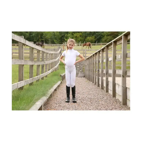 White equestrian cadiz mizs riding pants with a fitted design and subtle stitching perfect for competition use