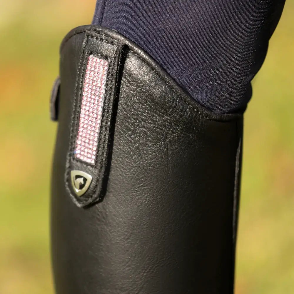 Black leather cascano riding boot with pink textured strap and silver shield logo from hy equestrian