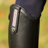 Black leather cascano riding boot with pink textured strap and silver shield logo from hy equestrian