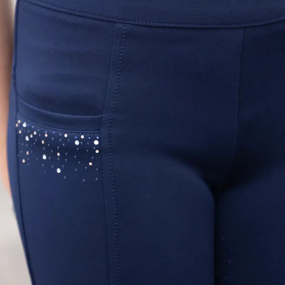 Navy blue stretch fabric children’s roka regal leggings with a sparkling silver rhinestone pocket for riding fun