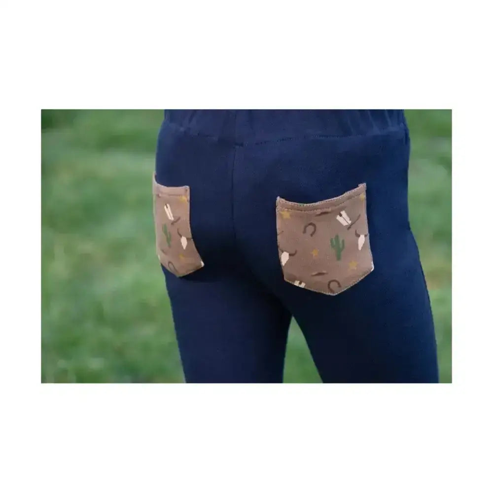 Back view of navy blue hy equestrian cowboy tots jodhpurs with brown cactus and horseshoe pockets perfect for a cowboy’s day