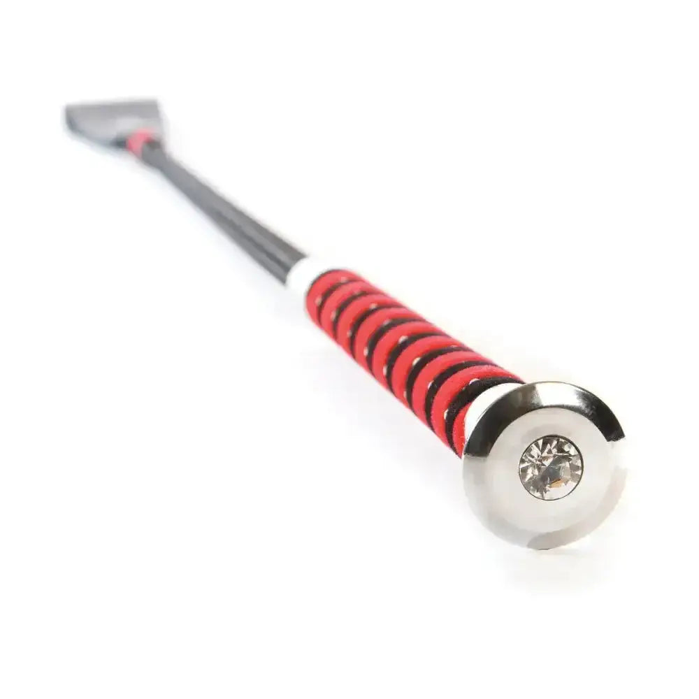 Red and black coiled handle on a hy equestrian diamante riding whip with a silver tip and diamante encrusted handle