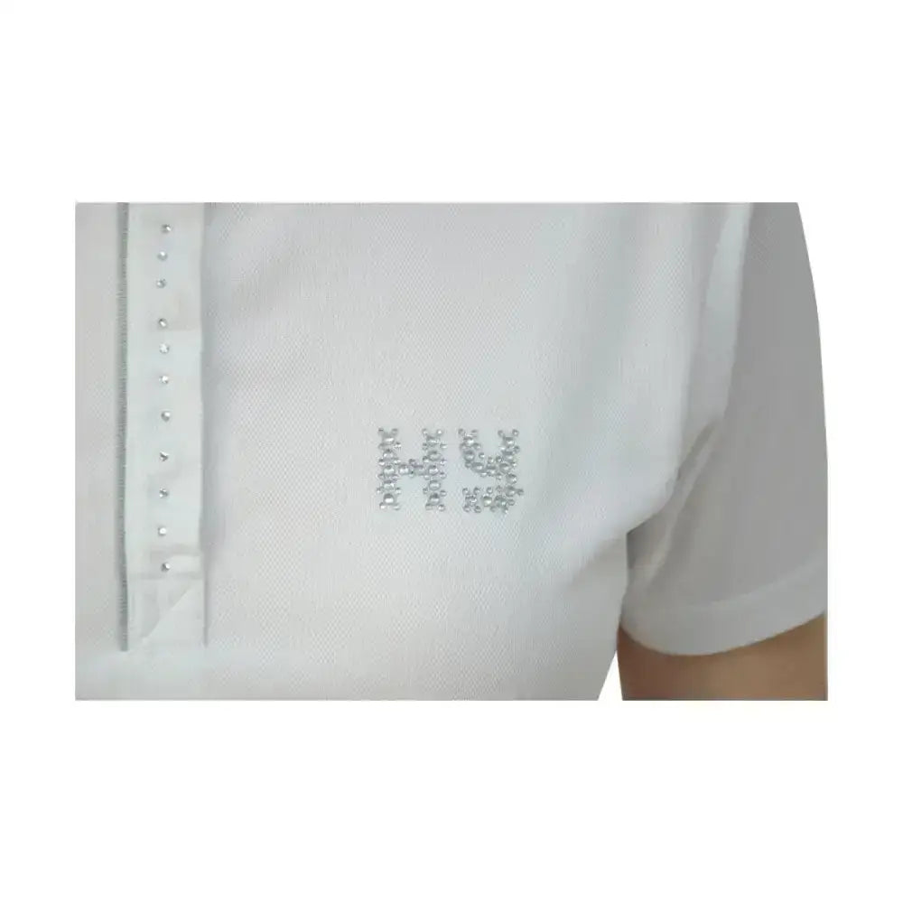 White polo shirt from hy equestrian diamante line with sparkling h logo and silver studs for competition wear