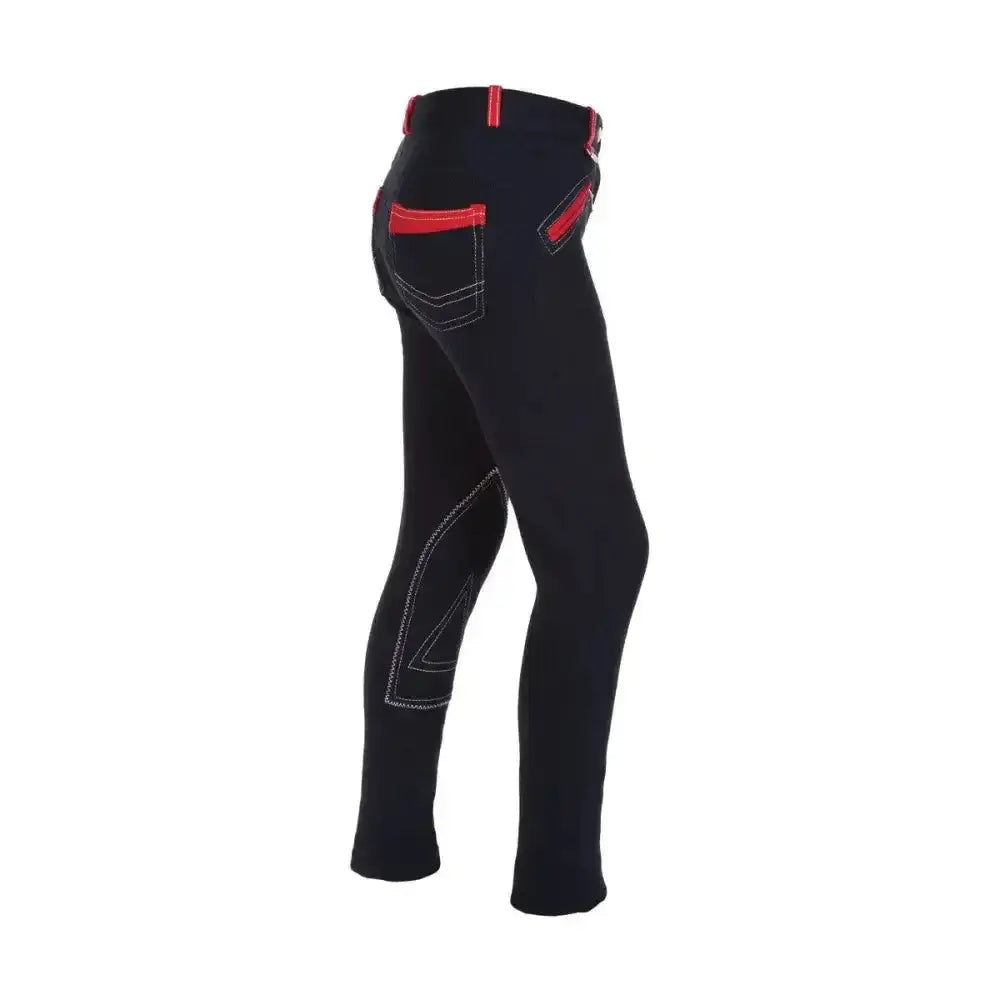 Back view of black hy equestrian diesel children’s jodhpurs with red trim and white stitching on leg panels
