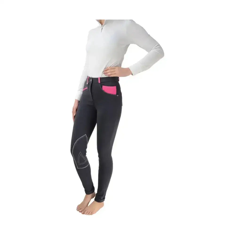 Black equestrian diesel ladies jodhpurs with vibrant pink accents and reinforced knee patches, fashionable and durable pants