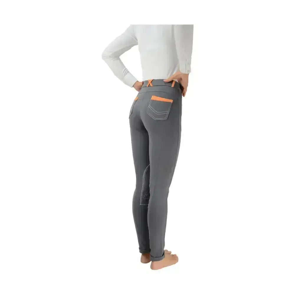 Gray equestrian diesel ladies jodhpurs with orange-trimmed pockets and stitching for fashionable riding