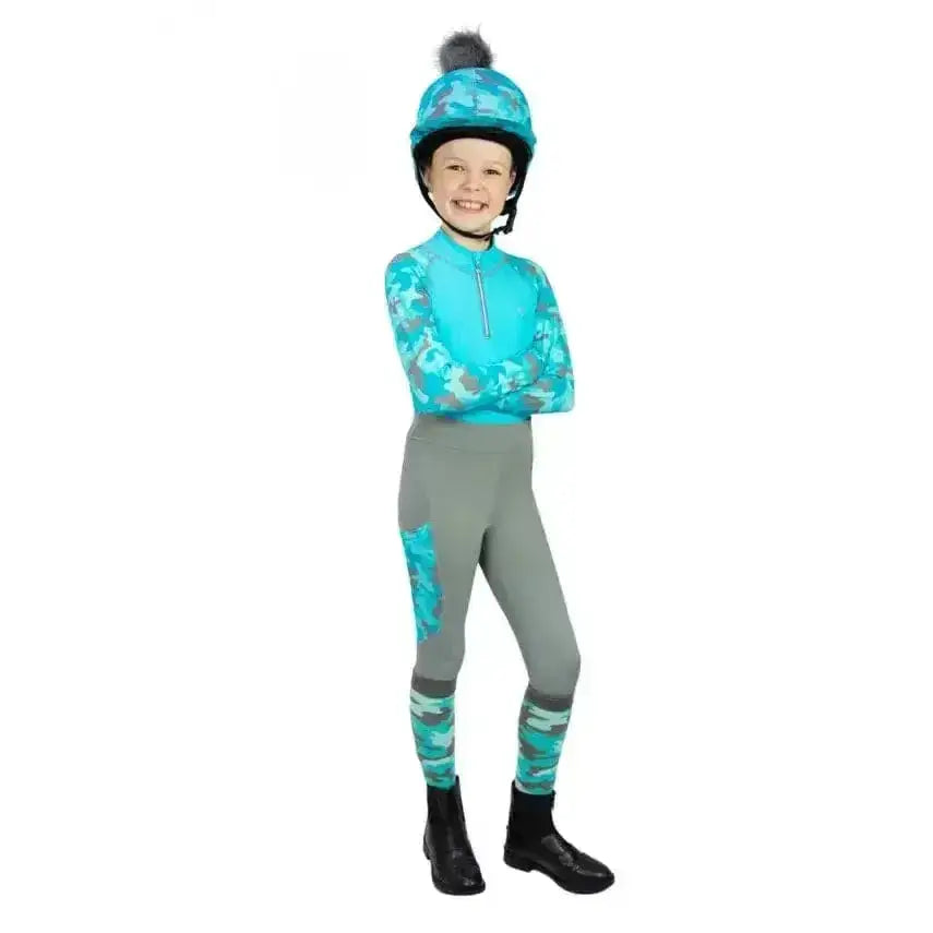 Child wearing hy equestrian dynaforce hat cover in turquoise and grey camouflage vibrant hat silk design